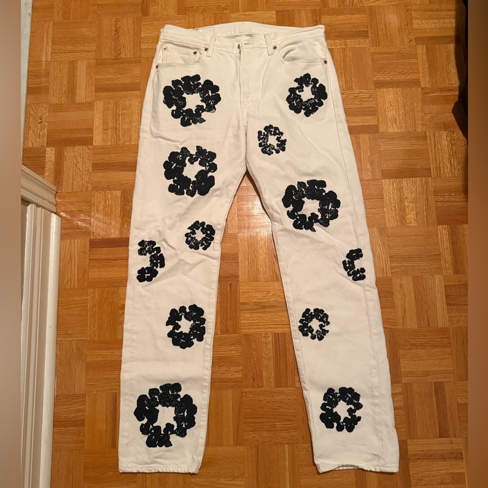 Denim Tears White Jeans with Black Floral Pattern